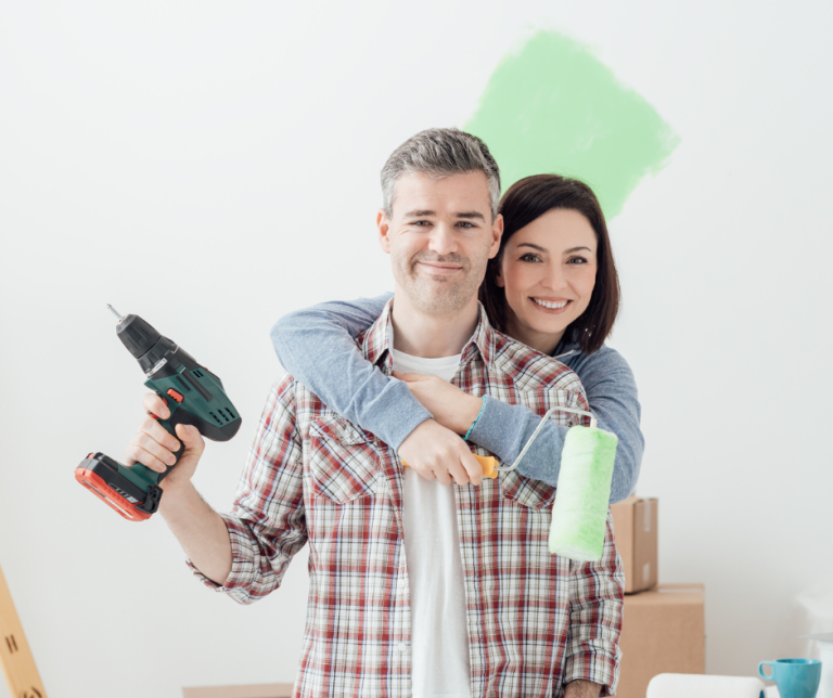 couple with paint roller and drill for renos Dawn Magee