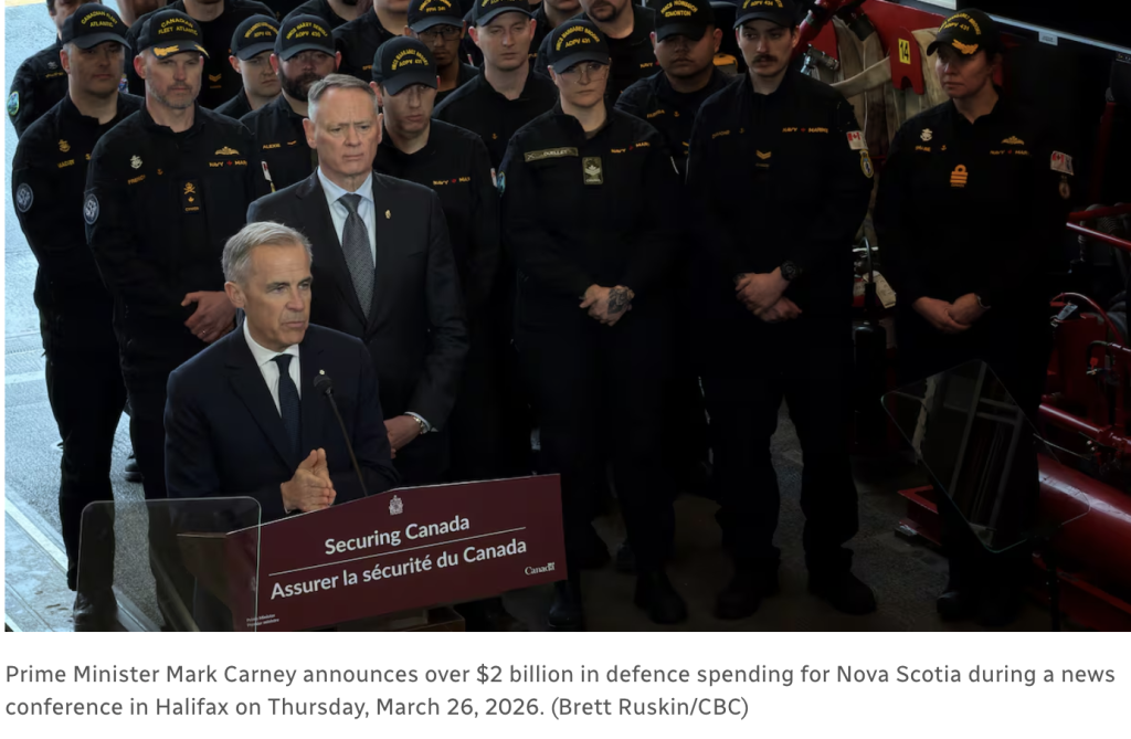Prime Minister Mark Carney stands at podium